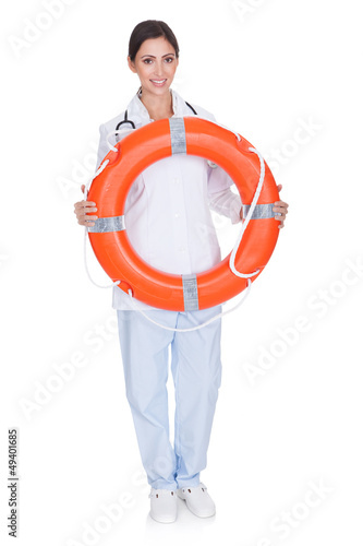 Smiling Female Doctor Holding Inflatable Ring