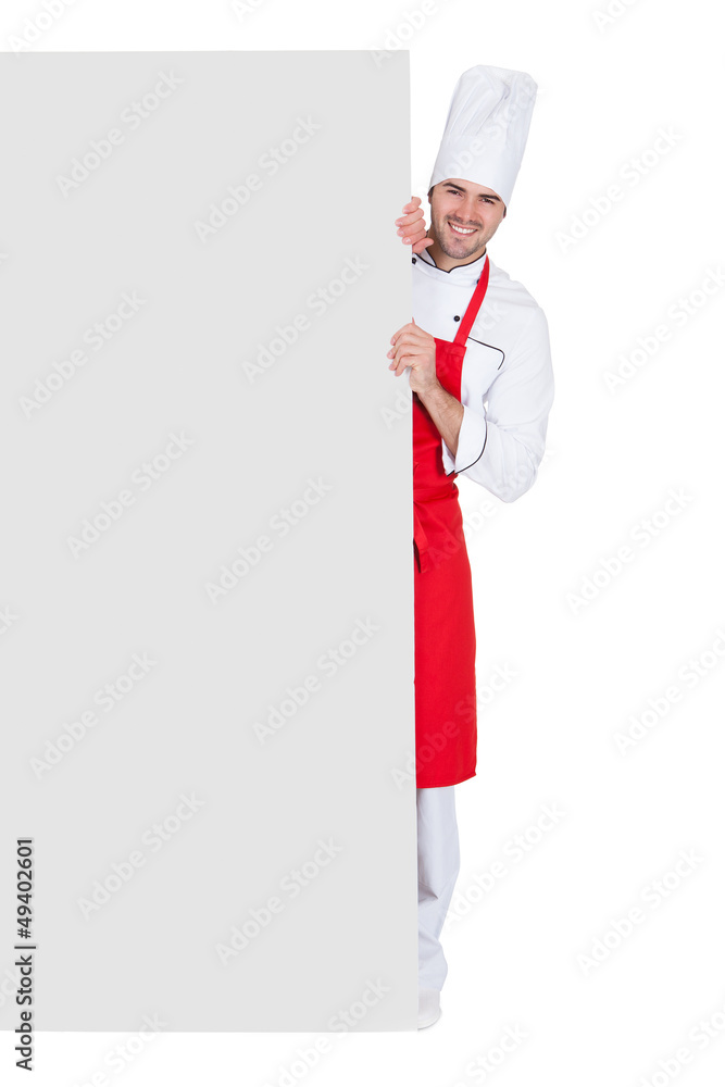 Chef in uniform presenting empty banner Chef in uniform presenting empty banner