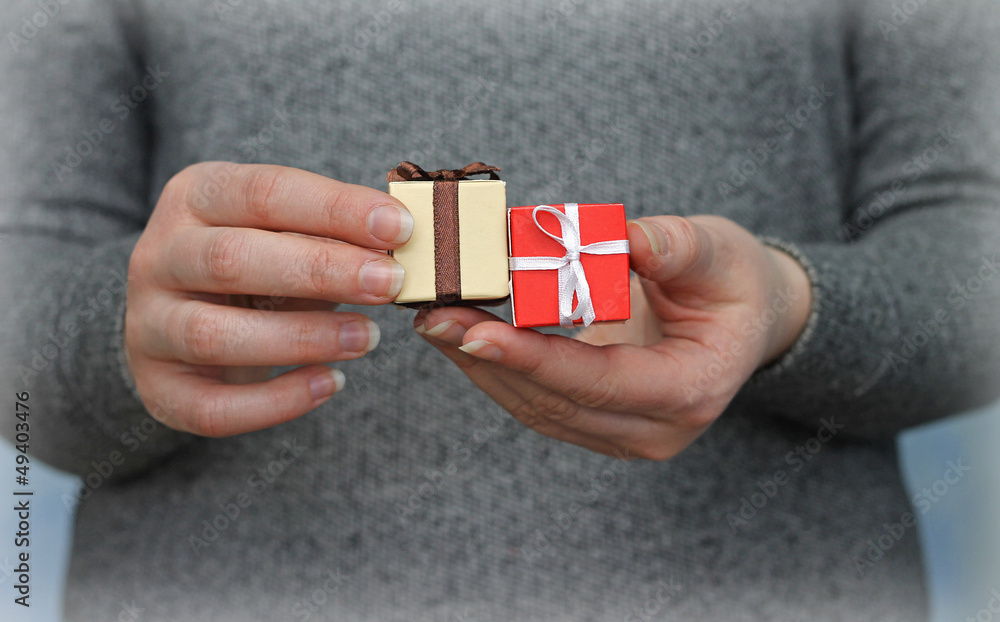 two gift boxes in woman's hands, close-up two gift boxes in woman's hands, close-up