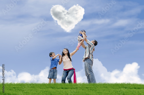 Family have fun under love clouds