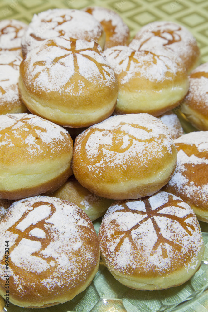 Sweet fresh baked donuts sprinkled with powdered sugar Sweet fresh baked donuts sprinkled with powdered sugar