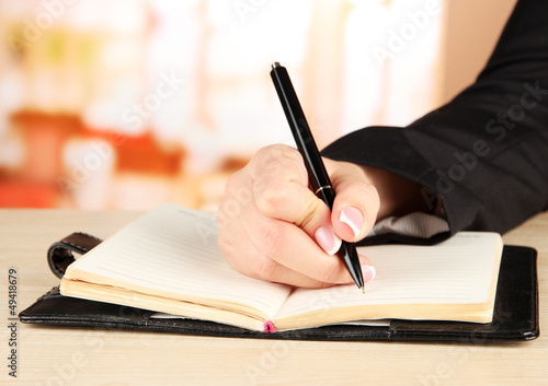 Hand write on notebook  on bright background