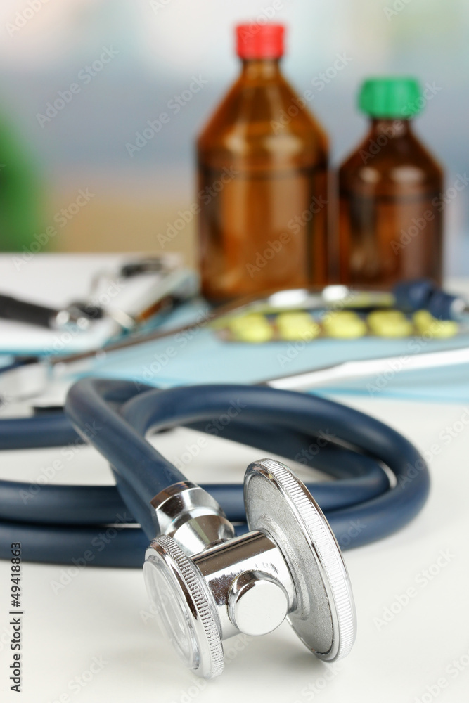 Fototapeta premium Stethoscope lying on the table close up