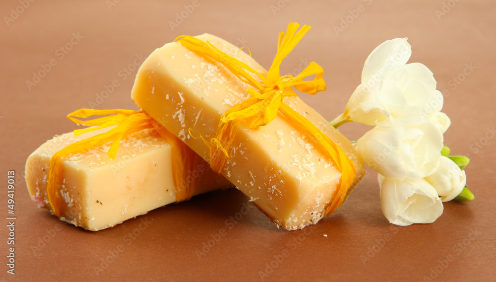 Natural handmade soap, on brown background Natural handmade soap, on brown background