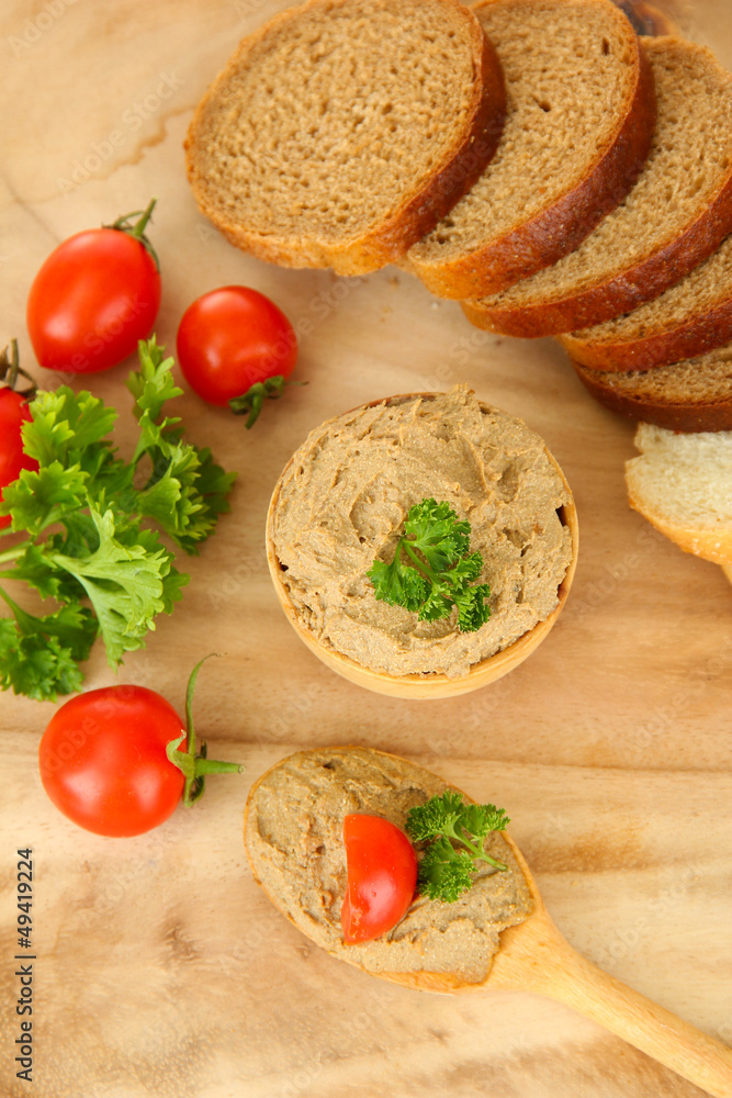 Fresh pate on wooden spoon, on wooden background Fresh pate on wooden spoon, on wooden background