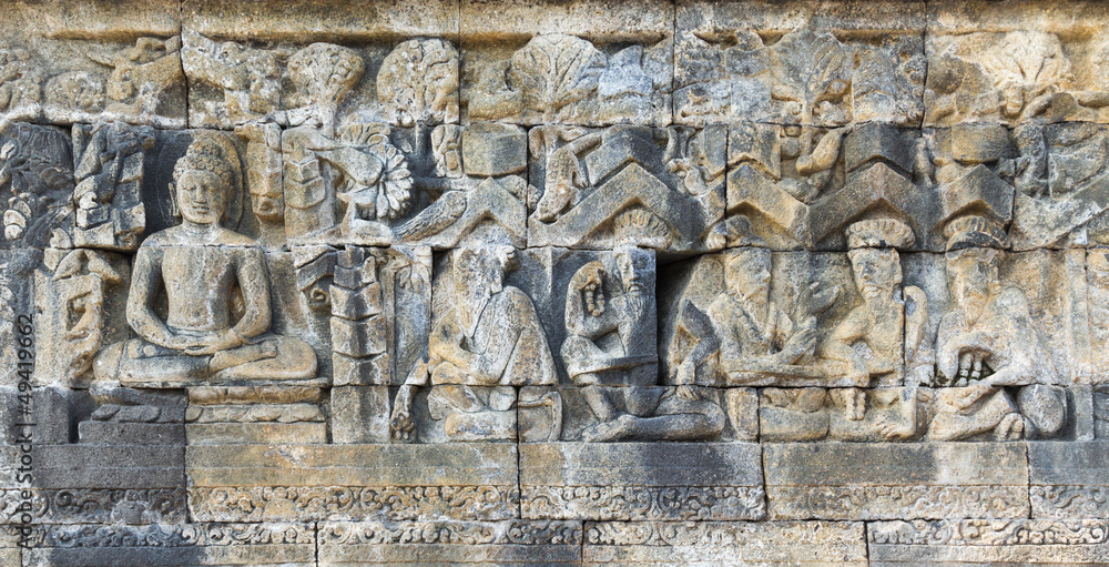 Buddha and men, bas relief carving. Buddha and men, bas relief carving.