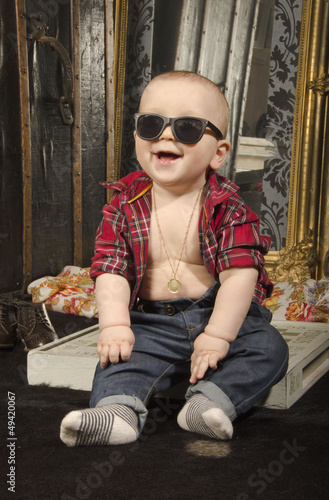 Playing little baby on the wooden floor