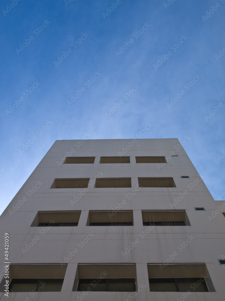 Facade windows of office building on blue sky Facade windows of office building on blue sky