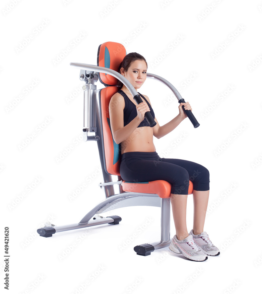 Fototapeta premium Beauty woman sitting on exerciser