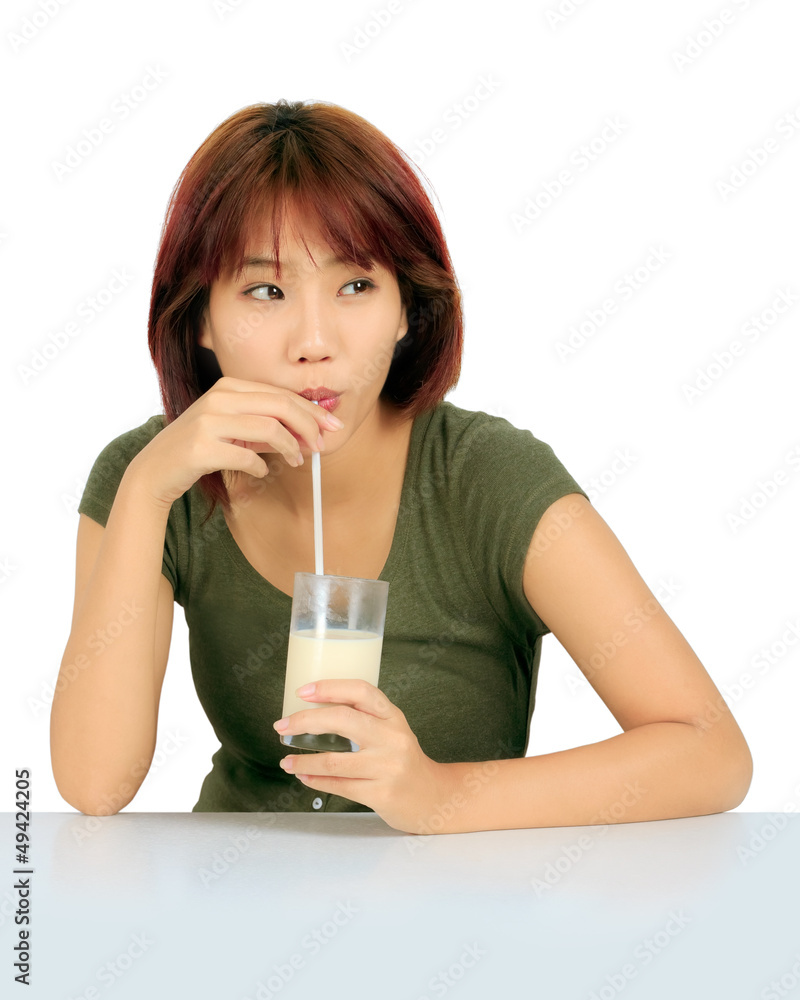 Isolated young asian woman with a glass of milk Isolated young asian woman with a glass of milk