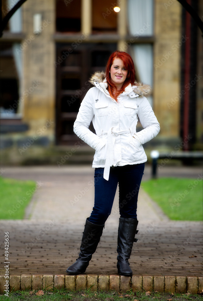 Fototapeta premium Pretty young red haired female outdoors
