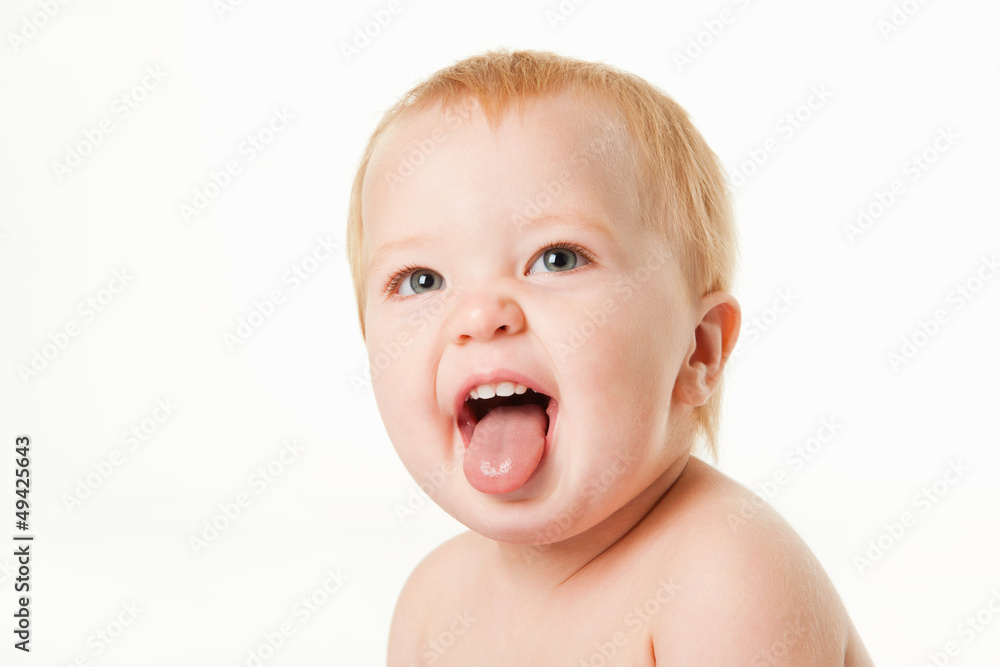 Portrait of funny baby, on a gray background Portrait of funny baby, on a gray background