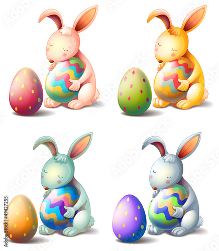 Four rabbits with easter eggs