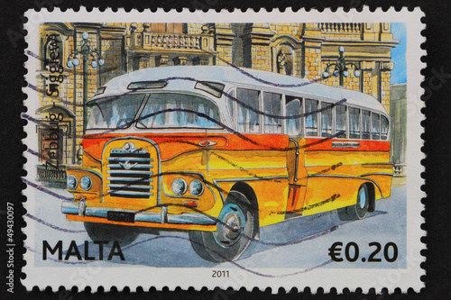 Malta: circa 2011; stamp with classic yellow Maltese bus