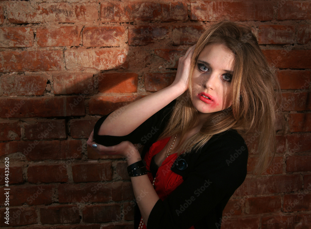 Fototapeta premium Portrait of sad woman with flowing makeup