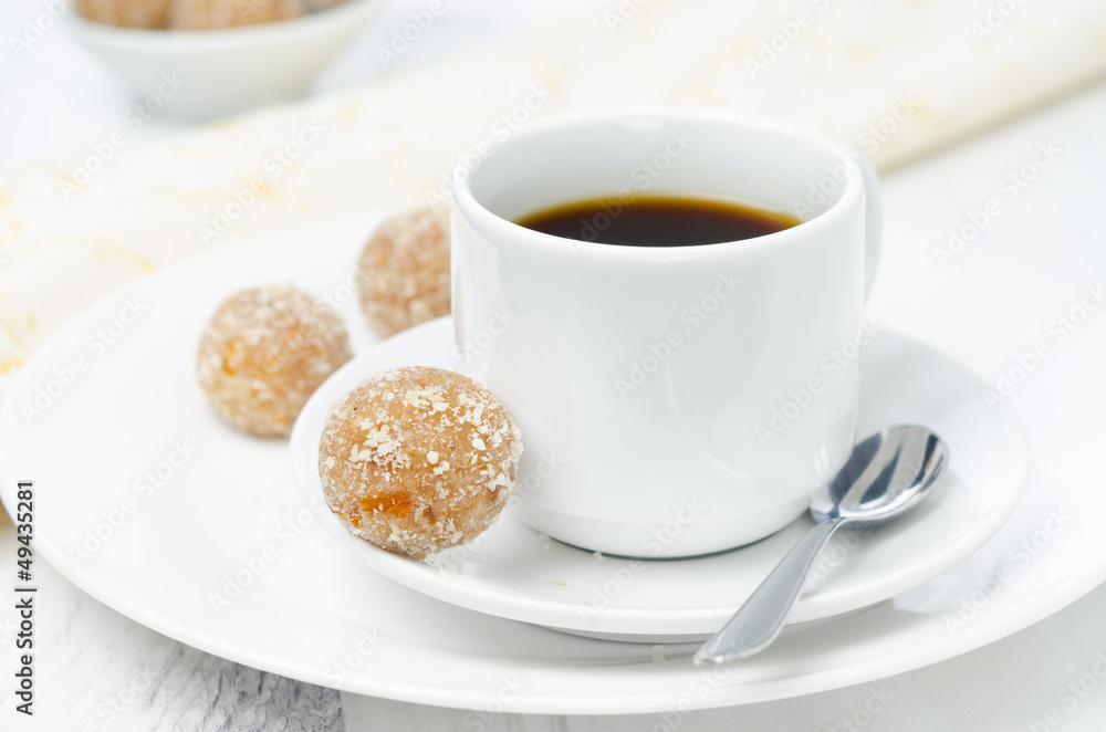 Homemade round candy made of almonds, ginger and dates Homemade round candy made of almonds, ginger and dates