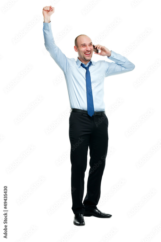 Happy businessman winning while talking on the phone Happy businessman winning while talking on the phone