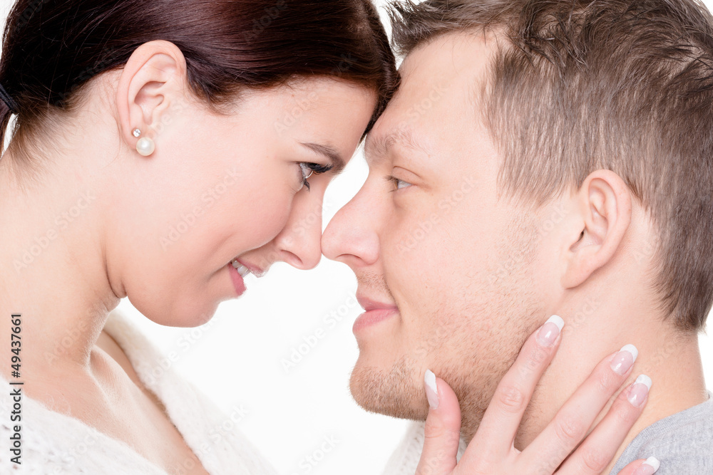 Young and happy couple in front of white background Young and happy couple in front of white background