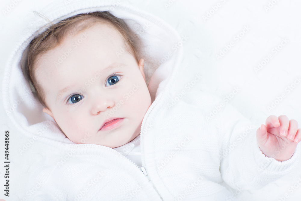 Curious baby watching into the camera Curious baby watching into the camera