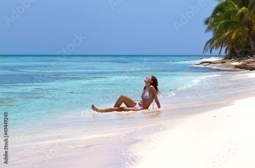 Woman enjoying the sun on beautiful tropical island
