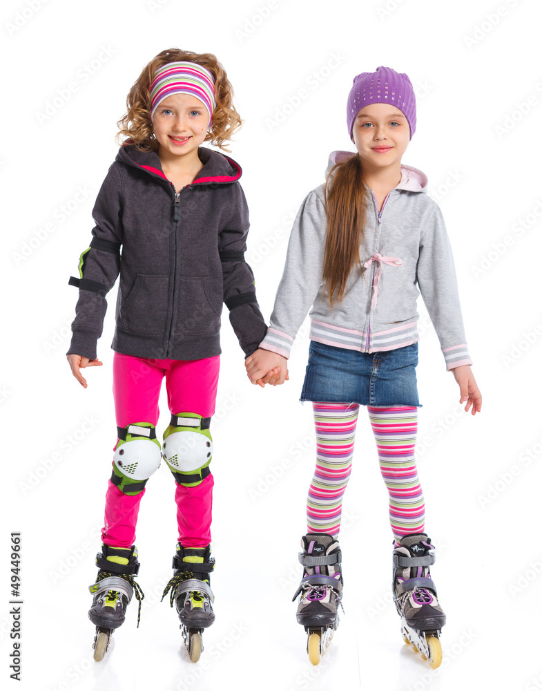 Two cute girls in roller skates Two cute girls in roller skates