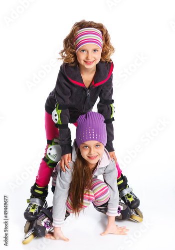 Two cute girls in roller skates