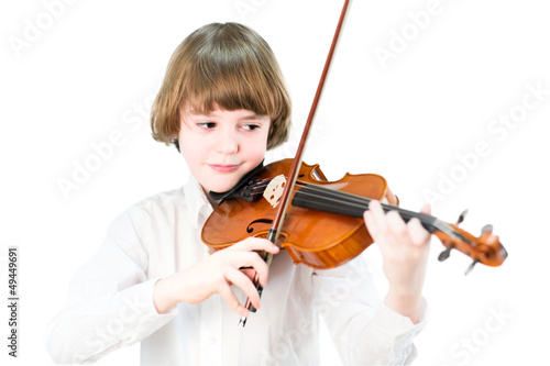 School child playing violin, isolated on white