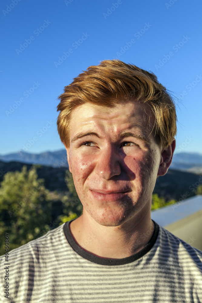 portrait of handsome boy with red hair under blue sky portrait of handsome boy with red hair under blue sky