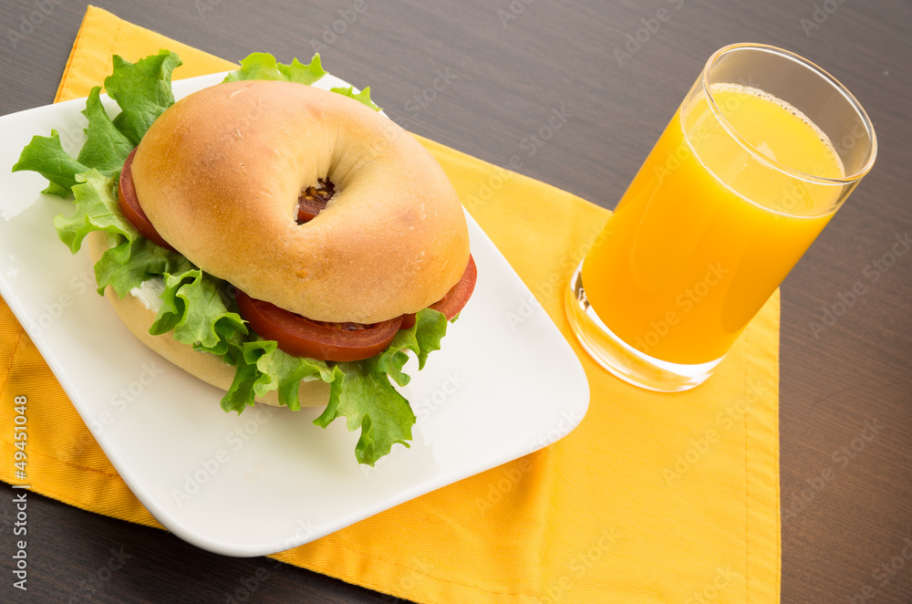 Bagel sandwich and orange juice Stock Photo | Adobe Stock