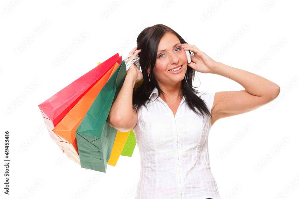 portrait cute young woman mobile phone while holding shopping ba portrait cute young woman mobile phone while holding shopping ba