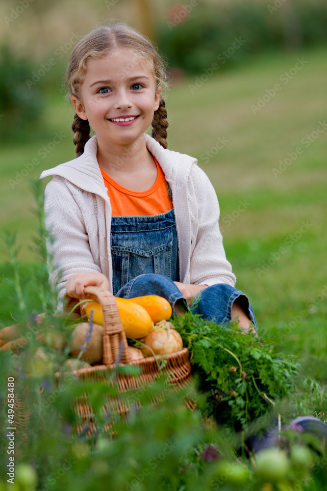 Vegetable garden - lovely girl with basket of vegetables Vegetable garden - lovely girl with basket of vegetables