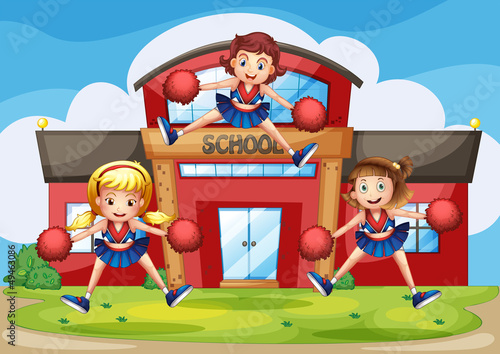 Cheerleaders performing in front of the school