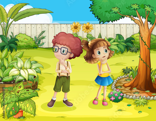 A girl and a boy in the backyard