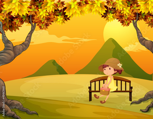 A girl at the bench in the park