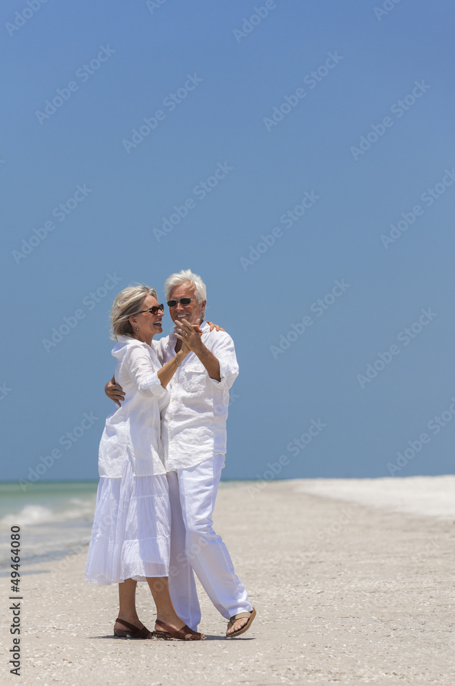 Happy Senior Couple Dancing on Tropical Beach Happy Senior Couple Dancing on Tropical Beach