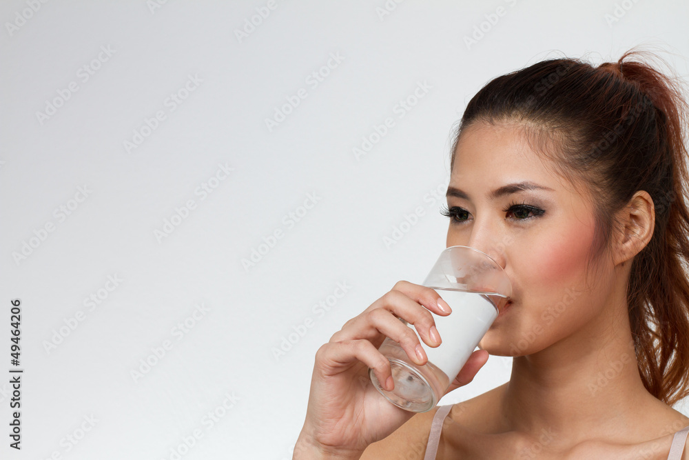 woman drinking water with text space or copyspace woman drinking water with text space or copyspace