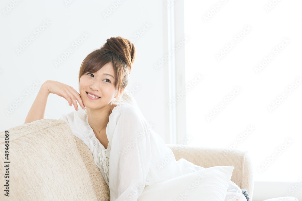 Beautiful asian woman relaxing in the room
