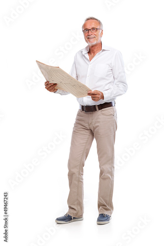 Casual senior man with newspaper, looking to camera photo