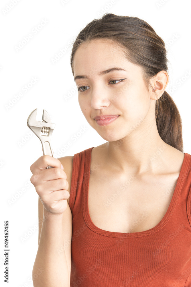 Attractive young woman holding monkey wrench Attractive young woman holding monkey wrench
