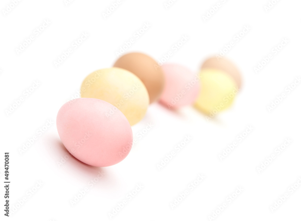 Winding line of multicolored hen's eggs, isolated on white Winding line of multicolored hen's eggs, isolated on white