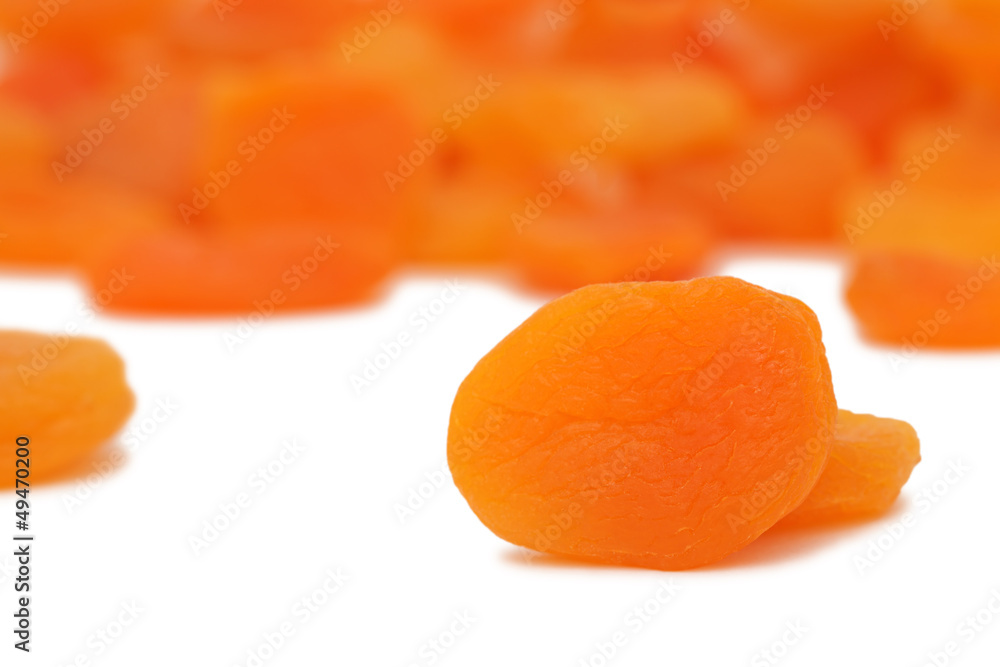 Scattered dried apricots on white background Scattered dried apricots on white background