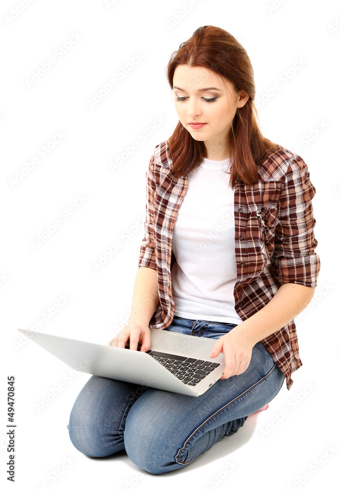 Naklejka premium Beautiful young woman with laptop isolated on white