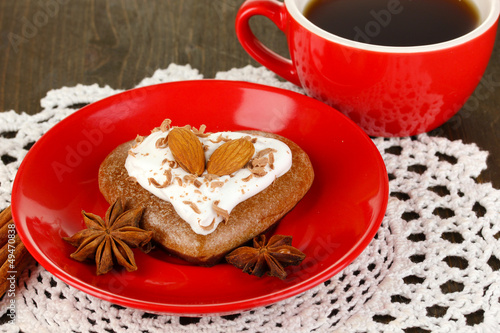 Chocolate cookie in form of heart with cup of coffee