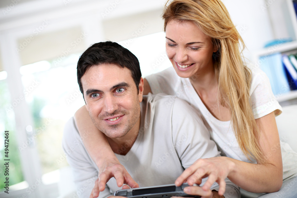 Couple at home playing video games Couple at home playing video games