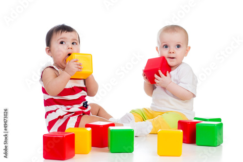 two babies girls playing to...