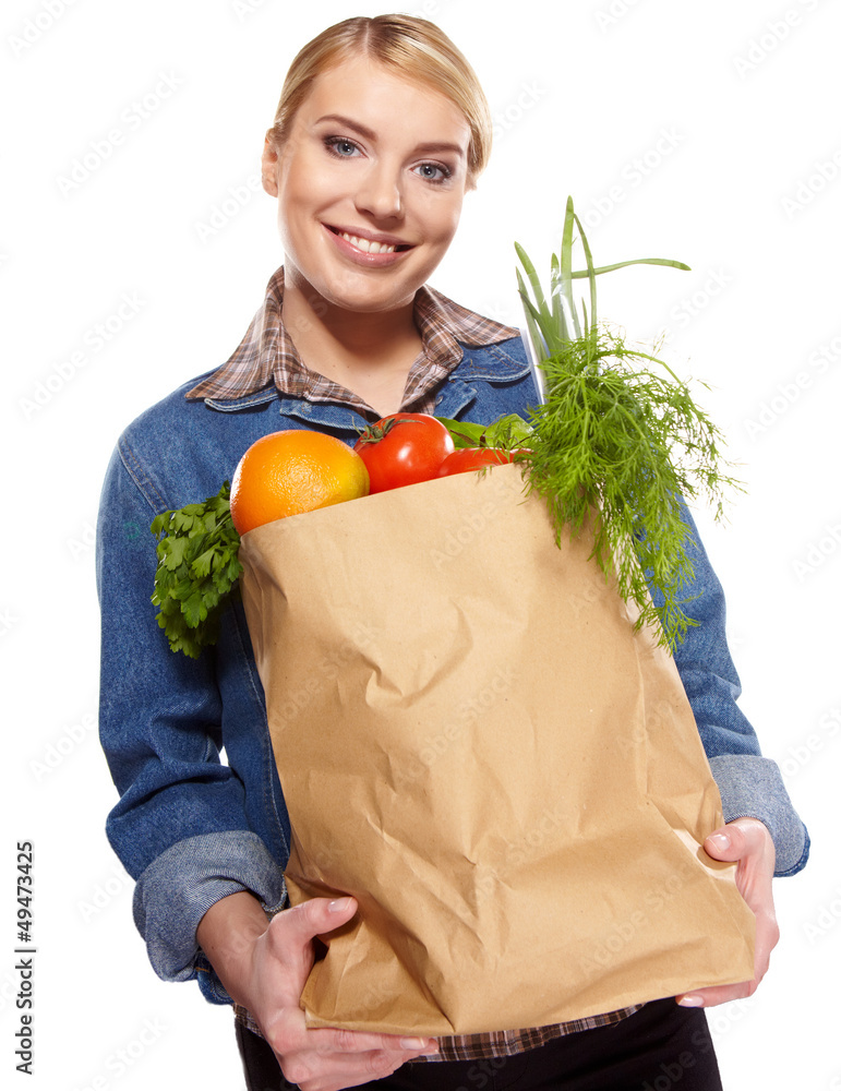 Young woman with a grocery shopping bag. Isolated on white backg Young woman with a grocery shopping bag. Isolated on white backg