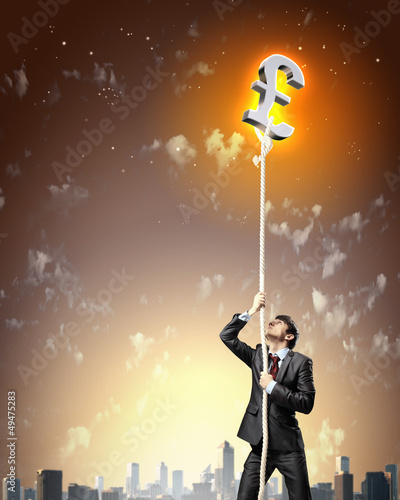 Image of businessman climbing rope © Sergey Nivens