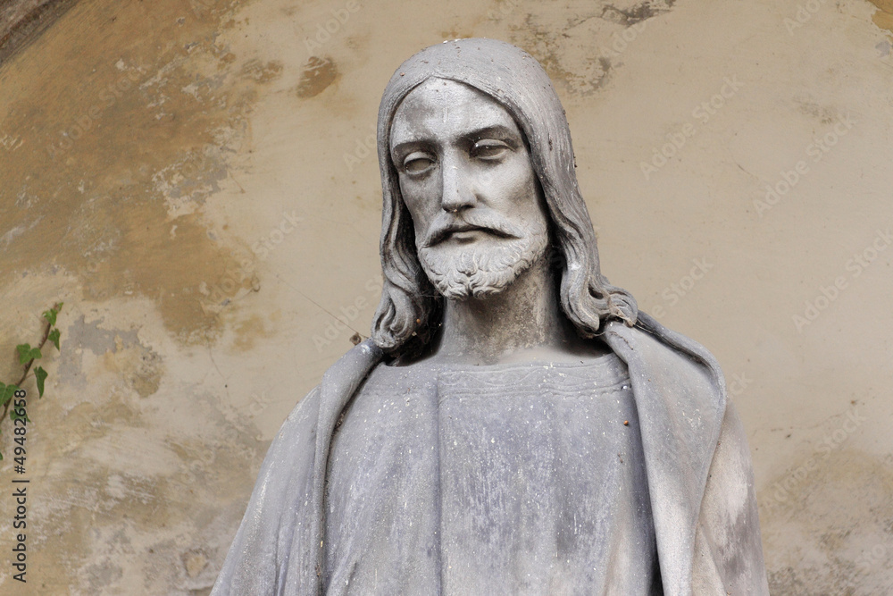 Fototapeta premium Historic Jesus on the old Prague Cemetery, Czech Republic
