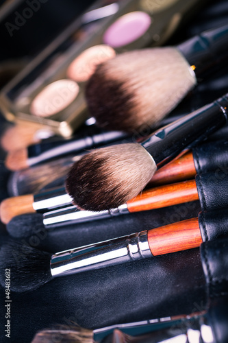 Professional make-up brushes with eye shadows palette.