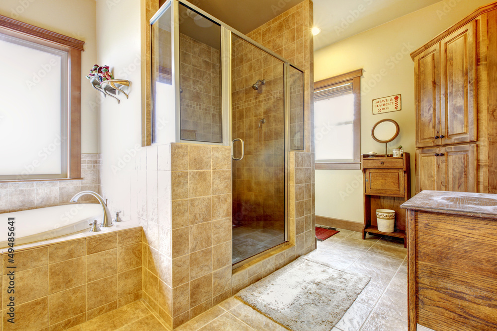 Fototapeta premium Large bathroom with wood furniture and natural colors.